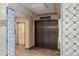 Building lobby with elevator access and decorative tile at 405 Central Ave # 700, St Petersburg, FL 33701