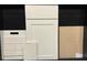 Kitchen design samples featuring white cabinets, quartz countertops, and wood-look tile at 5633 Clearwater Ct, Lakewood Ranch, FL 34211