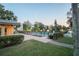 Evening view of a community pool with surrounding landscaping at 5980 Terrace Park Dr N # 113, St Petersburg, FL 33709