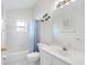 Clean bathroom with a shower/tub combo, toilet and vanity at 601 Canal Way, Oldsmar, FL 34677