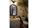 Bathroom with vanity, toilet, and tropical-themed decor at 6218 Palma Del Mar S Blvd # 503, St Petersburg, FL 33715