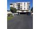 View of the front of the condo building and the parking garage at 6218 Palma Del Mar S Blvd # 503, St Petersburg, FL 33715