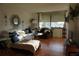 Living room with white sectional sofa, leather accent chair, and tiled floor at 6218 Palma Del Mar S Blvd # 503, St Petersburg, FL 33715