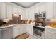 Well-equipped kitchen with dark brown tile backsplash at 6321 Vista Verde E Dr, St Petersburg, FL 33707