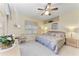 Spacious Primary bedroom with a king-size bed and ceiling fan at 6325 Stone River Rd, Bradenton, FL 34203