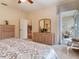 Bedroom with a ceiling fan and attached sitting room bathed in sunshine at 6325 Stone River Rd, Bradenton, FL 34203