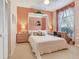 Cozy bedroom with a queen bed, desk, and dresser, offering a comfortable retreat at 6325 Stone River Rd, Bradenton, FL 34203
