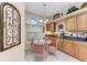 Charming breakfast nook with glass table and pink chairs at 6325 Stone River Rd, Bradenton, FL 34203