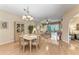 Charming dining room with hardwood floors and a chandelier at 6325 Stone River Rd, Bradenton, FL 34203