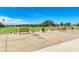 Golf driving range with multiple stations and benches at 6325 Stone River Rd, Bradenton, FL 34203