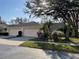 Beautiful single-story home with a well-manicured lawn and mature landscaping at 6325 Stone River Rd, Bradenton, FL 34203