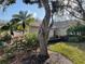 Property showcasing well-maintained landscaping, including palm trees at 6325 Stone River Rd, Bradenton, FL 34203