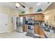 Kitchen features stainless steel appliances and wood cabinets at 6325 Stone River Rd, Bradenton, FL 34203