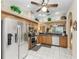 Well-appointed kitchen with stainless steel appliances, granite countertops, tile flooring, and ample cabinet space at 6325 Stone River Rd, Bradenton, FL 34203