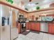 Modern kitchen with granite countertops, stainless appliances and breakfast bar at 6325 Stone River Rd, Bradenton, FL 34203