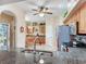 Kitchen with granite countertop and stainless steel appliances with a view to entry at 6325 Stone River Rd, Bradenton, FL 34203