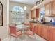 Eat-in kitchen features a glass table, four chairs, and lots of natural light at 6325 Stone River Rd, Bradenton, FL 34203
