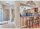 Open floor plan with a view from dining room to kitchen with eat-in bar at 6325 Stone River Rd, Bradenton, FL 34203