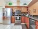 This kitchen features stainless steel appliances and a breakfast bar at 6325 Stone River Rd, Bradenton, FL 34203