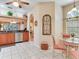Kitchen with granite countertops, stainless steel appliances, and adjacent dining area at 6325 Stone River Rd, Bradenton, FL 34203