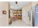 Cozy kitchen nook featuring a glass table, tile floors, natural light, and functional cabinetry at 6325 Stone River Rd, Bradenton, FL 34203