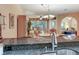 Bright and airy living area featuring hardwood floors, comfortable seating, and views of the outdoors at 6325 Stone River Rd, Bradenton, FL 34203