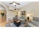 Cozy living room featuring plush seating, ceiling fan, and natural light at 6325 Stone River Rd, Bradenton, FL 34203