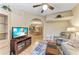 Open living room features high ceilings, hardwood floors, and flows into the dining area at 6325 Stone River Rd, Bradenton, FL 34203