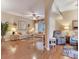 Open concept living area with ceiling fan, hardwood floors, and comfortable seating at 6325 Stone River Rd, Bradenton, FL 34203