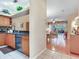 Open-concept kitchen and living area, featuring modern appliances, plenty of counter space, and hardwood floors at 6325 Stone River Rd, Bradenton, FL 34203