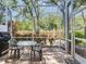 Screened patio with table and chairs, providing a relaxing outdoor living space at 6325 Stone River Rd, Bradenton, FL 34203