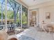 Cozy screened lanai with outdoor seating and view of the yard at 6325 Stone River Rd, Bradenton, FL 34203