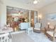 Enclosed patio features tile flooring and comfortable seating, ideal for relaxation and enjoying the indoor-outdoor living at 6325 Stone River Rd, Bradenton, FL 34203
