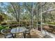 This beautiful screened patio has comfortable seating and views of the serene and private yard at 6325 Stone River Rd, Bradenton, FL 34203