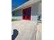 Red double doors leading to backyard at 735 Bertrend St, Englewood, FL 34223