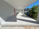 Covered back patio with concrete flooring at 735 Bertrend St, Englewood, FL 34223