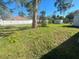 Spacious backyard with large tree and shed at 735 Bertrend St, Englewood, FL 34223
