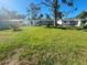 Large grassy backyard with shed at 735 Bertrend St, Englewood, FL 34223