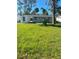 Spacious backyard with shed and trees at 735 Bertrend St, Englewood, FL 34223