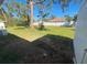 Large grassy backyard with mature trees at 735 Bertrend St, Englewood, FL 34223