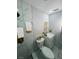 Elegant bathroom with gold accents and marble tile at 735 Bertrend St, Englewood, FL 34223