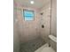 Clean bathroom with marble shower and tile floors at 735 Bertrend St, Englewood, FL 34223