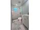 Modern bathroom with marble shower and vanity at 735 Bertrend St, Englewood, FL 34223
