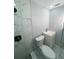Updated bathroom with marble shower and vanity at 735 Bertrend St, Englewood, FL 34223