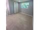Simple bedroom with sliding closet doors at 735 Bertrend St, Englewood, FL 34223