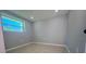 Cozy bedroom with neutral walls and tile floors at 735 Bertrend St, Englewood, FL 34223