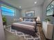 Spacious bedroom with large bed and modern dresser at 735 Bertrend St, Englewood, FL 34223