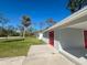 Newly painted home with red front door at 735 Bertrend St, Englewood, FL 34223