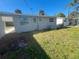 Side view of house, gray exterior at 735 Bertrend St, Englewood, FL 34223