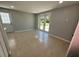 Tiled floor and access to backyard from interior at 735 Bertrend St, Englewood, FL 34223